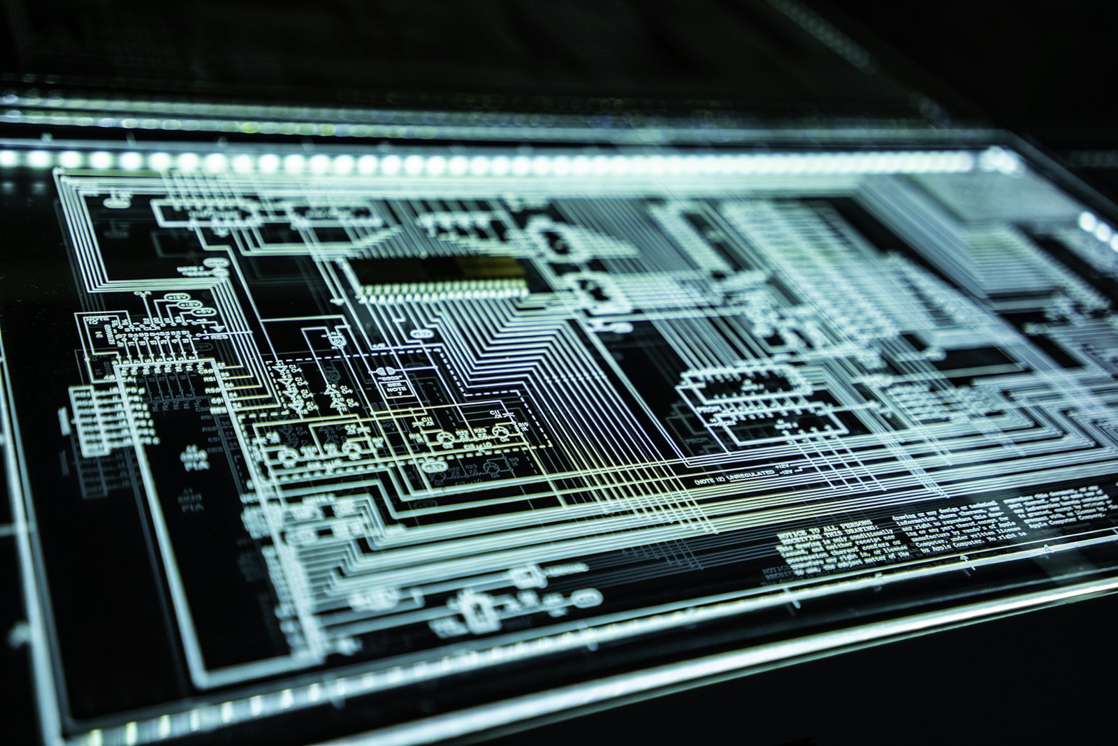 Blue light across a dark technology surface